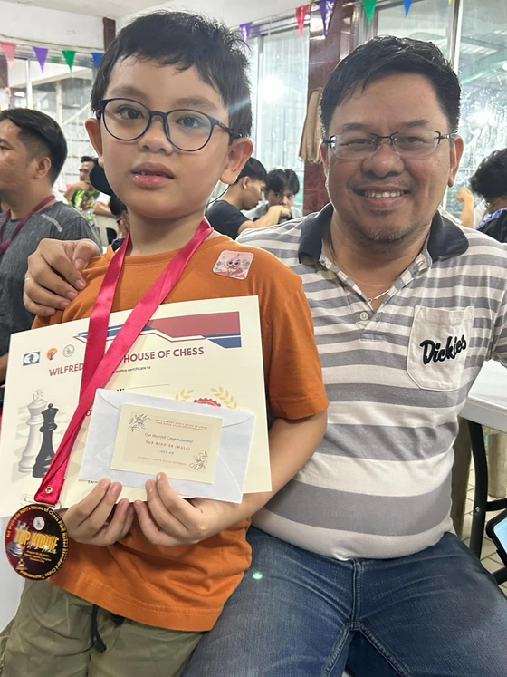 Marius with his master coach, FIDE Master Noel Dela Cruz
