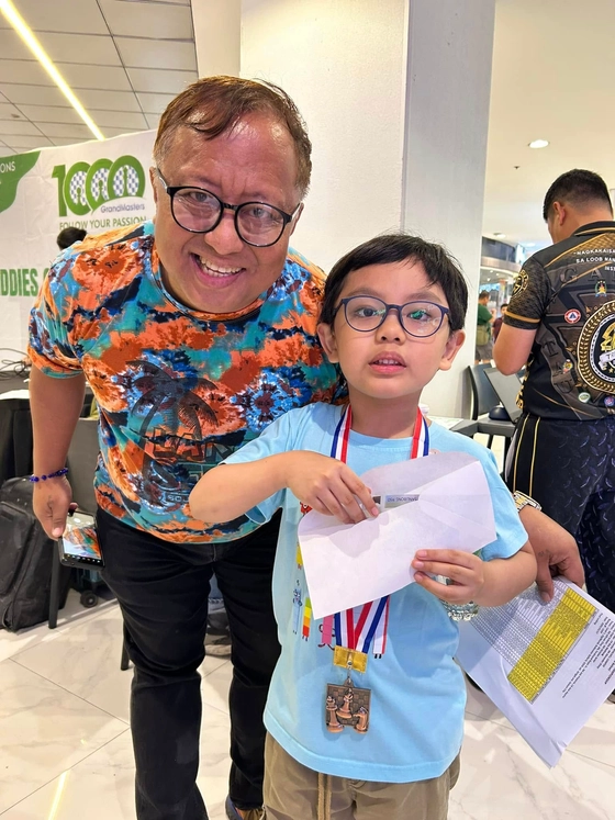 Marius with Sir Winch El, a strong chess supporter in the Philippines