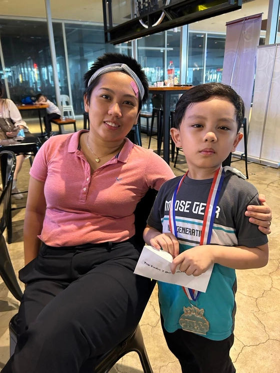 Marius with Woman Grandmaster Janelle Frayna