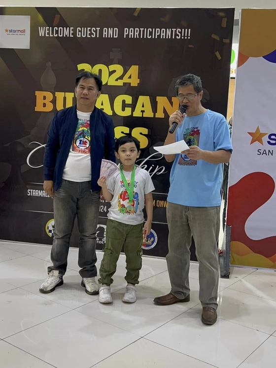Marius with Sir Richard dela Cruz and Arbiter Chay at Bulacan Chess Tournament
