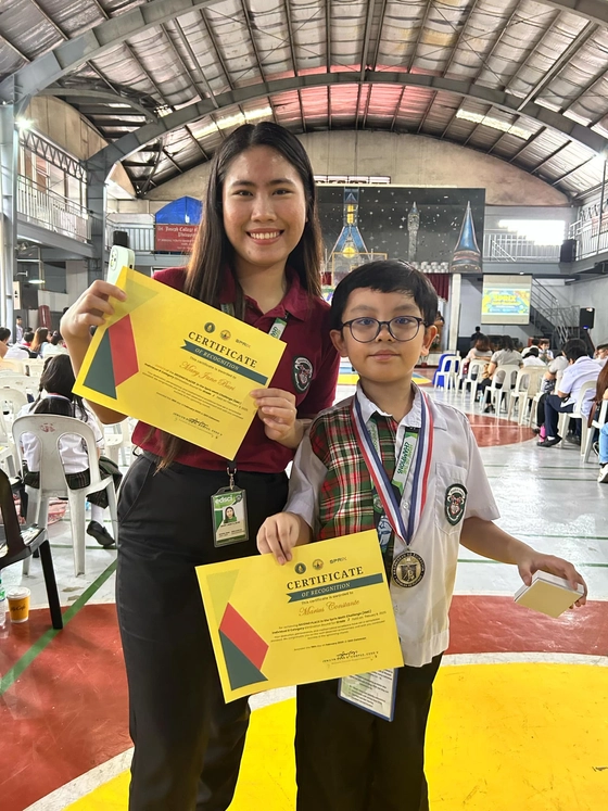 Marius with Coach Jane for Sprix Math Challenge